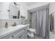 Modern bathroom features updated vanity, mirror, and tiled shower at 5717 60Th N Way, St Petersburg, FL 33709