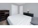 Serene bedroom featuring neutral tones, wood-look floors, and ample closet space at 5717 60Th N Way, St Petersburg, FL 33709