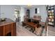 The dining area features a large wooden table with seating for six and stylish decor at 5717 60Th N Way, St Petersburg, FL 33709
