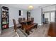 Cozy dining room with a wooden table, bench seating, and decorative rug at 5717 60Th N Way, St Petersburg, FL 33709