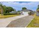 Quaint one-story home with an ample driveway and a well-maintained lawn at 5717 60Th N Way, St Petersburg, FL 33709