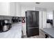 Kitchen includes an island, stainless steel appliances, and plenty of storage space at 5717 60Th N Way, St Petersburg, FL 33709