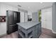 Contemporary kitchen with sleek island, modern appliances, and ample storage space at 5717 60Th N Way, St Petersburg, FL 33709