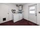This laundry room features a washer, dryer, and storage space, enhancing functionality at 5717 60Th N Way, St Petersburg, FL 33709