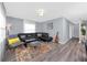 Inviting living room with modern decor, comfortable seating, stylish rug, and ample natural light at 5717 60Th N Way, St Petersburg, FL 33709