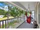 Enjoy the views from the second-story balcony featuring outdoor seating and serene neighborhood views at 5907 S Elkins Ave, Tampa, FL 33611