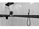 Modern shower features beautiful black and white tile, sleek fixtures, and shower niche at 5907 S Elkins Ave, Tampa, FL 33611