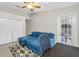 Comfortable bedroom features sliding door access, closet space, and an open floor plan at 6001 Laketree Ln # B, Temple Terrace, FL 33617