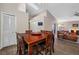 Dining room with hardwood flooring and vaulted ceiling, adjacent to the living room area at 6001 Laketree Ln # B, Temple Terrace, FL 33617