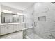 Elegant bathroom featuring a marble walk-in shower and double sink vanity at 6605 N Nebraska Ave # 25, Tampa, FL 33604