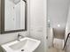 Modern bathroom featuring sleek fixtures, a white vanity and stairway entry at 6605 N Nebraska Ave # 25, Tampa, FL 33604