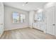 Bright, empty bedroom with neutral walls, wood flooring, and natural light at 6605 N Nebraska Ave # 25, Tampa, FL 33604