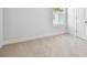 Cozy bedroom featuring a carpeted floor, ample natural light, and a closet at 6605 N Nebraska Ave # 25, Tampa, FL 33604
