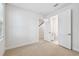 Neutral bedroom featuring stairway and en suite bathroom access at 6605 N Nebraska Ave # 25, Tampa, FL 33604