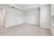 Spacious carpeted bedroom with natural lighting and neutral color palette at 6605 N Nebraska Ave # 25, Tampa, FL 33604