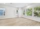 Bright bedroom offers neutral walls, wood flooring, and natural light at 6605 N Nebraska Ave # 25, Tampa, FL 33604