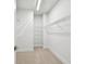 Walk-in closet with carpet flooring and wire shelving units for optimal storage at 6605 N Nebraska Ave # 25, Tampa, FL 33604