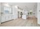 Modern kitchen with white cabinetry, stainless steel appliances, and an open floor plan at 6605 N Nebraska Ave # 25, Tampa, FL 33604