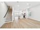 Open concept living space with wood floors, large windows, and natural light at 6605 N Nebraska Ave # 25, Tampa, FL 33604