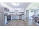 Updated kitchen featuring stainless steel appliances, granite countertops, and a dining area at 6704 N Branch Ave, Tampa, FL 33604