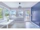 Bright living room with large windows, light-colored floors and modern furnishings at 6704 N Branch Ave, Tampa, FL 33604