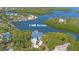 Stunning aerial view of a waterfront home with direct Gulf access and lush tropical landscaping at 6805 Arroyo Dr, New Port Richey, FL 34652