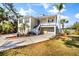 Beautiful two-story home with a spacious driveway and lovely landscaping enhancing its curb appeal at 6805 Arroyo Dr, New Port Richey, FL 34652