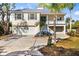 Charming coastal home with a well-manicured front yard, spacious driveway, and a two-car garage at 6805 Arroyo Dr, New Port Richey, FL 34652
