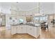Open floor plan connects kitchen, living room, and dining area, perfect for entertaining at 6805 Arroyo Dr, New Port Richey, FL 34652
