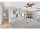 Living room has a stone fireplace, display shelves, and view of the backyard at 6805 Arroyo Dr, New Port Richey, FL 34652
