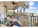 Spacious screened porch with comfortable seating and amazing lake views offer relaxing outdoor living at 6805 Arroyo Dr, New Port Richey, FL 34652