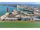 Aerial view of waterfront condos with pool, tennis courts, and boat docks at 7910 Sun Island S Dr # 404, South Pasadena, FL 33707