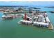This aerial shows the community's waterfront location and views of the bay at 7910 Sun Island S Dr # 404, South Pasadena, FL 33707