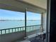 Balcony with a scenic waterfront view, metal railings, and rolling blinds at 7910 Sun Island S Dr # 404, South Pasadena, FL 33707
