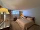 Cozy bedroom with neutral tones, a comfortable bed, and matching dresser sets at 7910 Sun Island S Dr # 404, South Pasadena, FL 33707