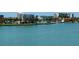 Expansive water view showcasing a calm bay, condos, and lush greenery at 7910 Sun Island S Dr # 404, South Pasadena, FL 33707