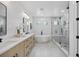 Beautiful bathroom featuring dual sinks, soaking tub, and glass-enclosed shower for a spa-like experience at 816 W Orient St, Tampa, FL 33603