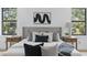 A luxurious bedroom features stylish decor, with lamps, a headboard, accent pillows and large windows at 816 W Orient St, Tampa, FL 33603