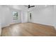 Bright bedroom featuring hardwood floors, neutral walls, and a modern ceiling fan at 816 W Orient St, Tampa, FL 33603