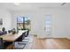 Dining room features modern table, chairs, and lighting and an outdoor view through a large window at 816 W Orient St, Tampa, FL 33603