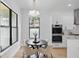 Cozy dining area with a round table and modern lighting fixture at 816 W Orient St, Tampa, FL 33603