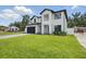 Contemporary home with lush green lawn and minimalist landscaping at 816 W Orient St, Tampa, FL 33603