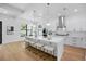 Bright, open kitchen with a large island and white cabinetry at 816 W Orient St, Tampa, FL 33603