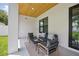 Cozy covered patio setup with a seating area, perfect for relaxing at 816 W Orient St, Tampa, FL 33603