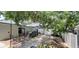 Backyard featuring a patio area, outdoor seating, and well-kept landscaping at 8207 Volusia Pl, Tampa, FL 33637