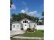 Charming single-Gathering home with a modern design, well-manicured lawn, and attached garage at 8207 Volusia Pl, Tampa, FL 33637