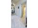 Bright foyer featuring marble tile flooring, chandelier lighting and access to other rooms in the home at 8207 Volusia Pl, Tampa, FL 33637