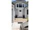 Inviting front entrance featuring patterned tiles and a welcoming front door at 8207 Volusia Pl, Tampa, FL 33637