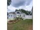 Charming single-Gathering home featuring a landscaped front yard and inviting curb appeal at 8207 Volusia Pl, Tampa, FL 33637