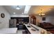 Spacious kitchen with dark wood cabinets, stainless steel appliances, and an open layout into the living area at 8207 Volusia Pl, Tampa, FL 33637